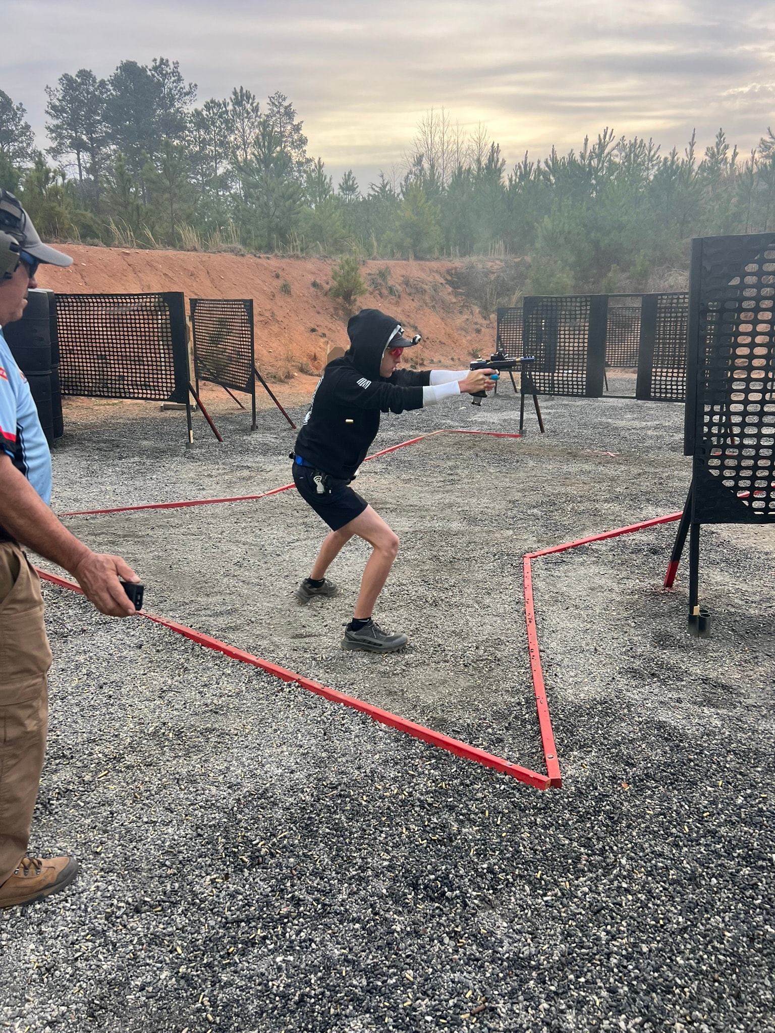 Tripp Wilson running a USPSA stage at the Tom Castro Shooting Academy